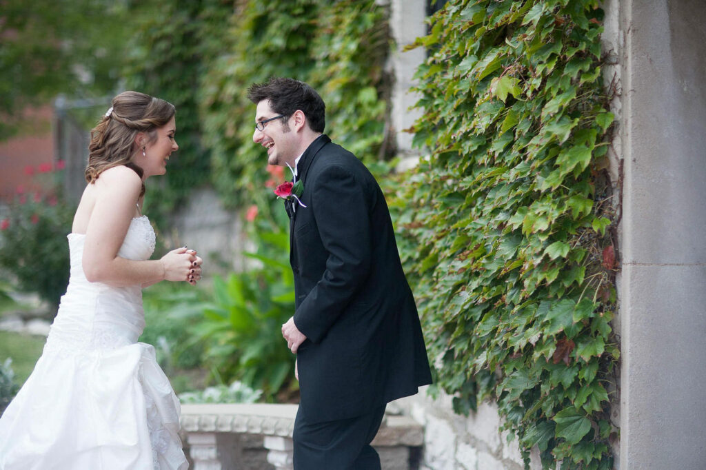 Bride and groom gt a case of the giggles during their first look before their wedding in st louis photographed by Pinxit Photo